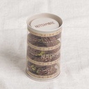 Chocolate Pecan Pistachio Bites in cylinder box